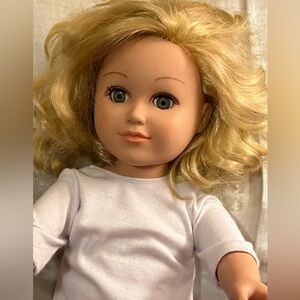 Beautiful blonde doll by cititoy.date stamped is 2013.